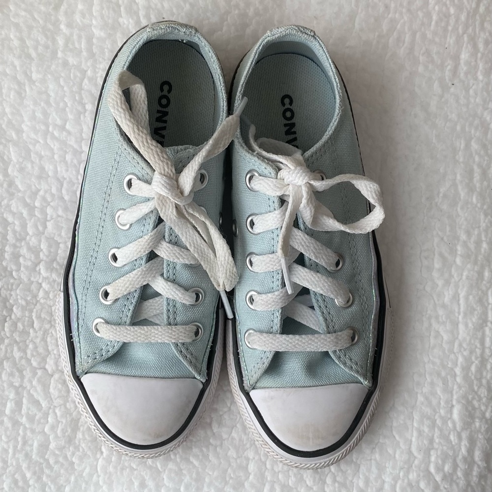 Converse Chuck Taylor blue shoes.